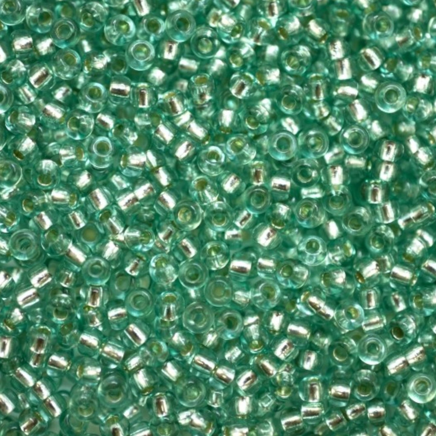 10/0 78164 Preciosa Czech Glass Seed Beads Rocailles 2.3mm. Green 2 dyed Crystal, Silver Lined.