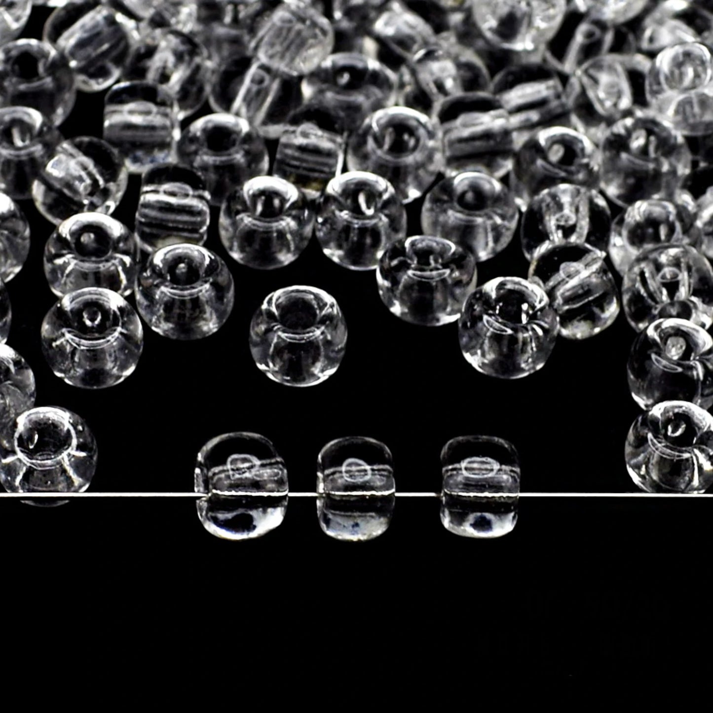 2/0 00050 Preciosa Seed Beads. Transparent natural.