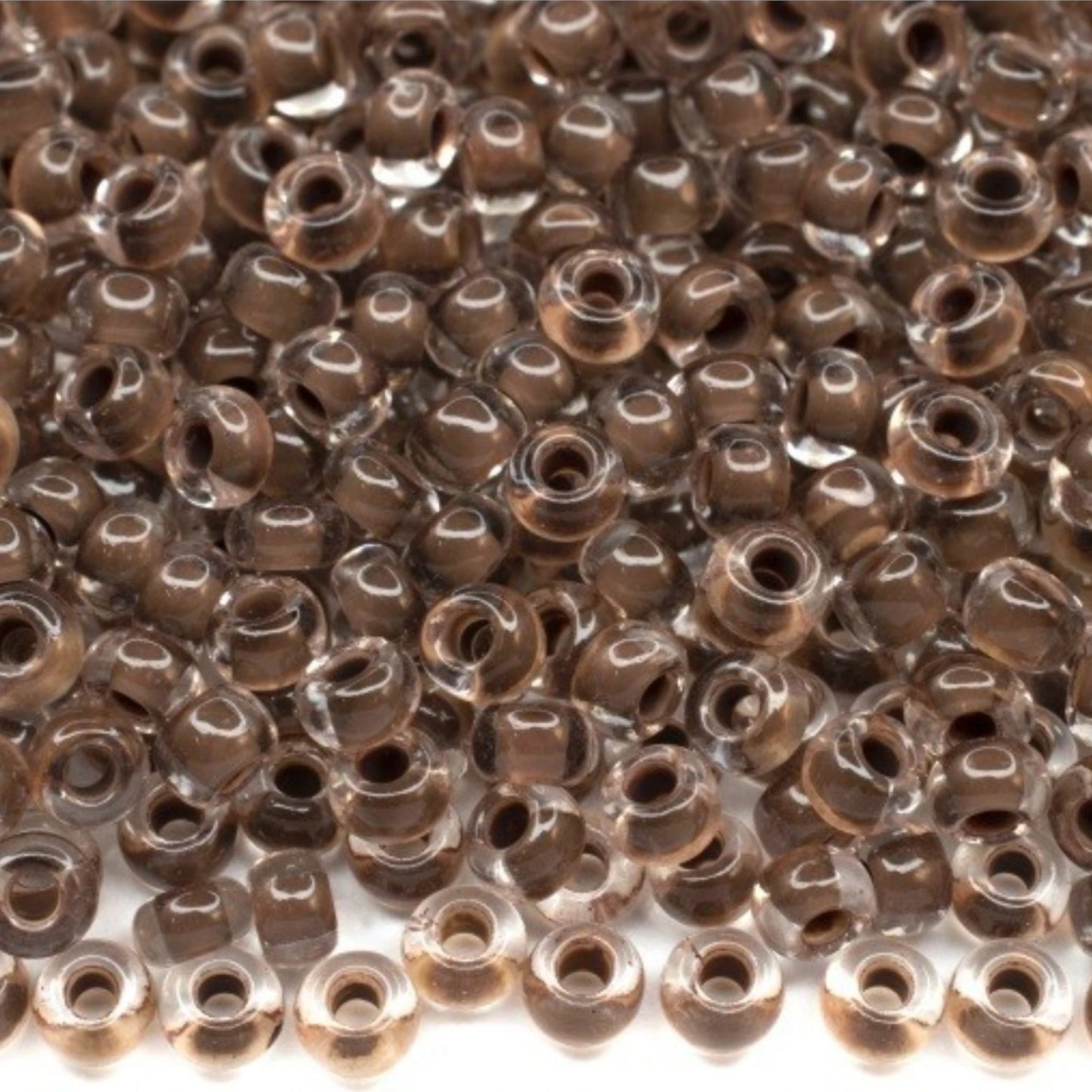 6/0 08A19 Preciosa Czech Glass Mărgele Rocaille 4.1mm. Crystal terra intensive dark brown lining.