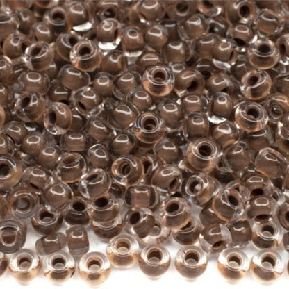 6/0 08A19 Preciosa Czech Glass Mărgele Rocaille 4.1mm. Crystal terra intensive dark brown lining.