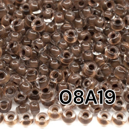 6/0 08A19 Preciosa Czech Glass Mărgele Rocaille 4.1mm. Crystal terra intensive dark brown lining.