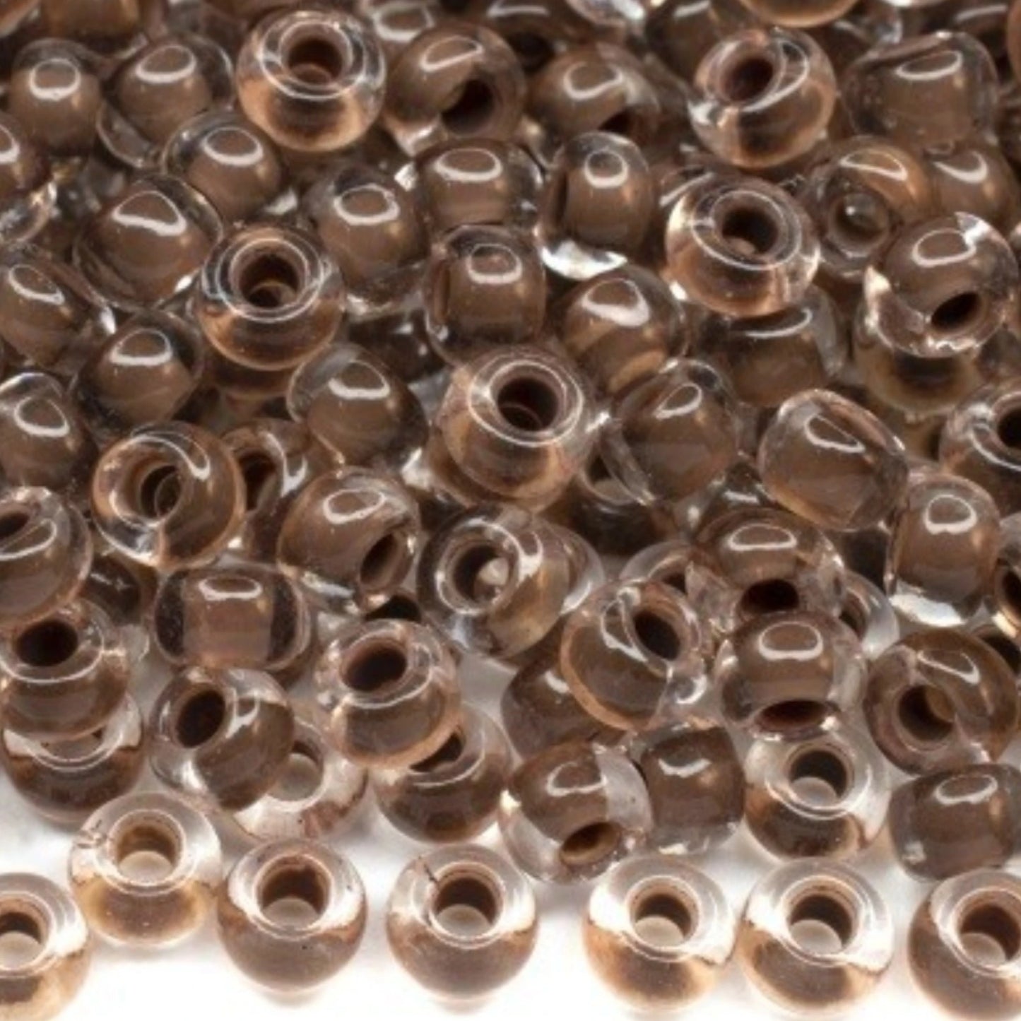 6/0 08A19 Preciosa Czech Glass Mărgele Rocaille 4.1mm. Crystal terra intensive dark brown lining.