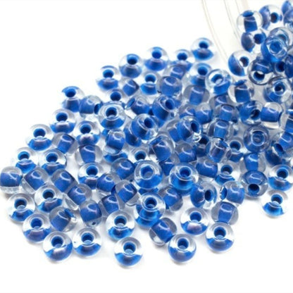 6/0 08A38 Preciosa Czech Glass Seed Beads Rocailles 4.1mm. Crystal terra intensive blue lining.