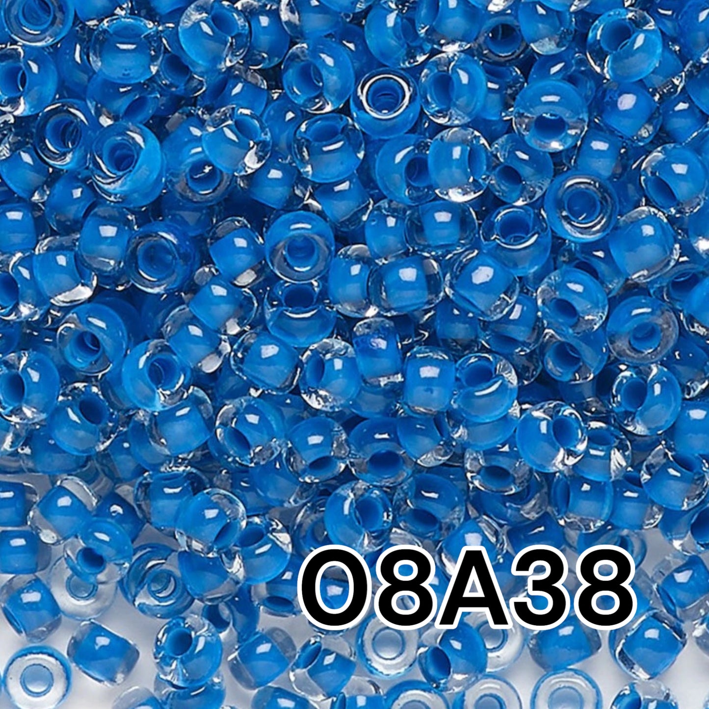 6/0 08A38 Preciosa Czech Glass Seed Beads Rocailles 4.1mm. Crystal terra intensive blue lining.