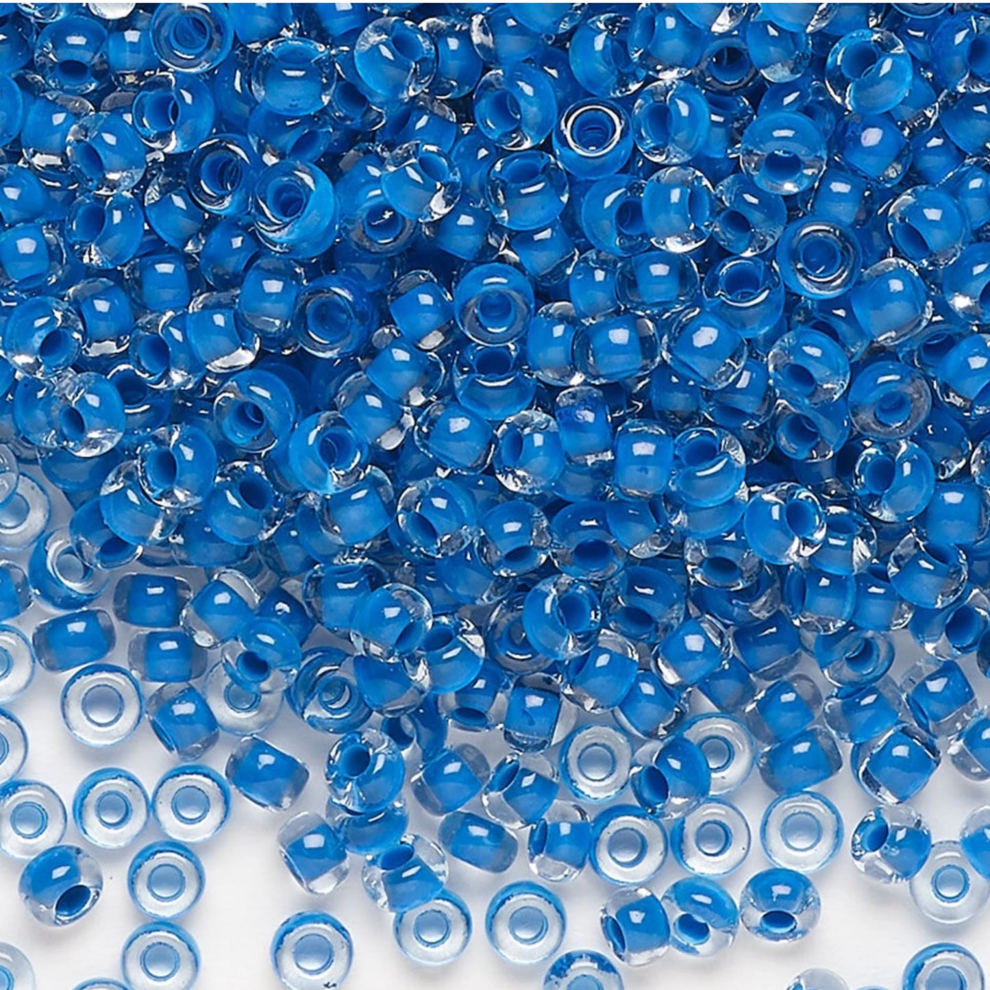 6/0 08A38 Preciosa Czech Glass Seed Beads Rocailles 4.1mm. Crystal terra intensive blue lining.