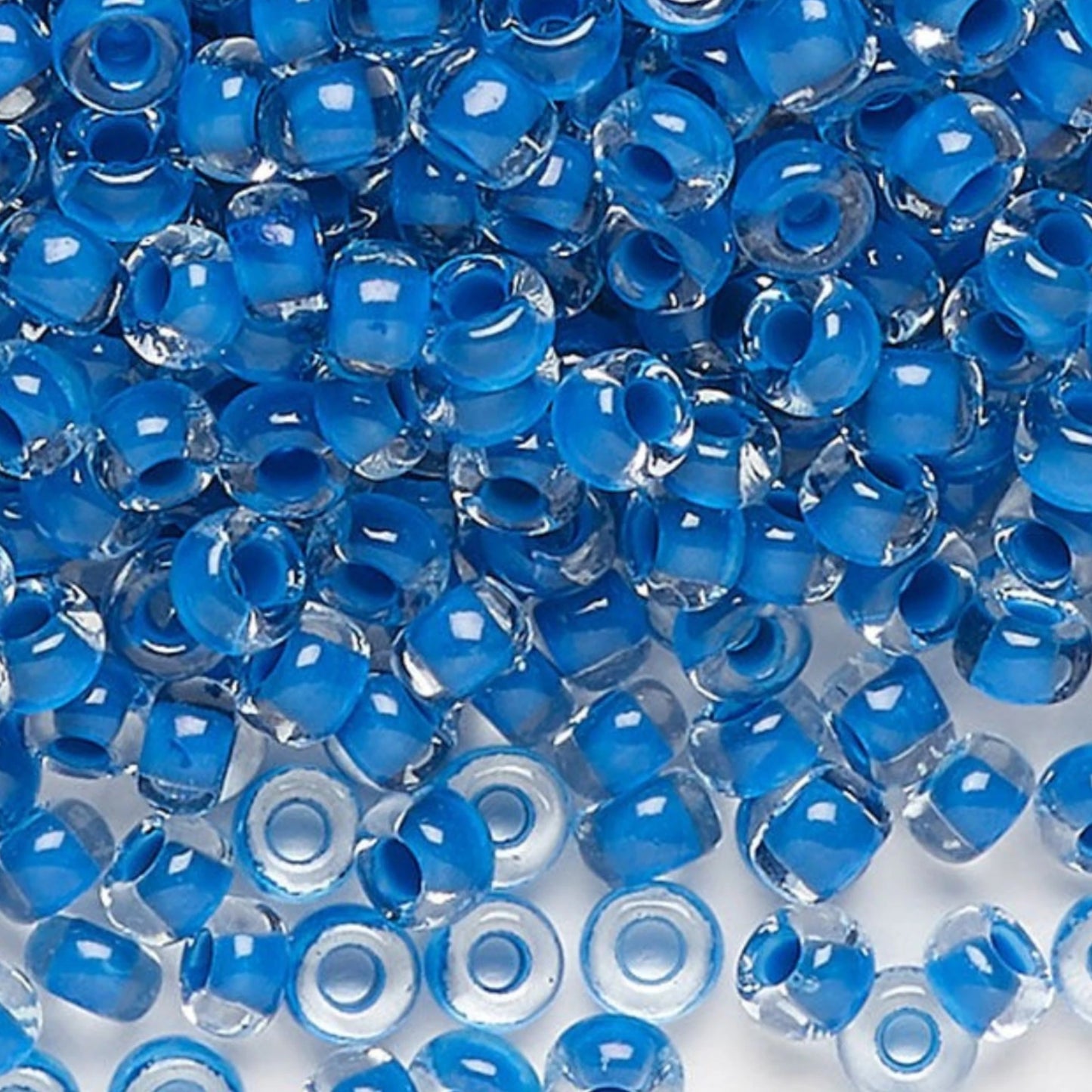 6/0 08A38 Preciosa Czech Glass Seed Beads Rocailles 4.1mm. Crystal terra intensive blue lining.
