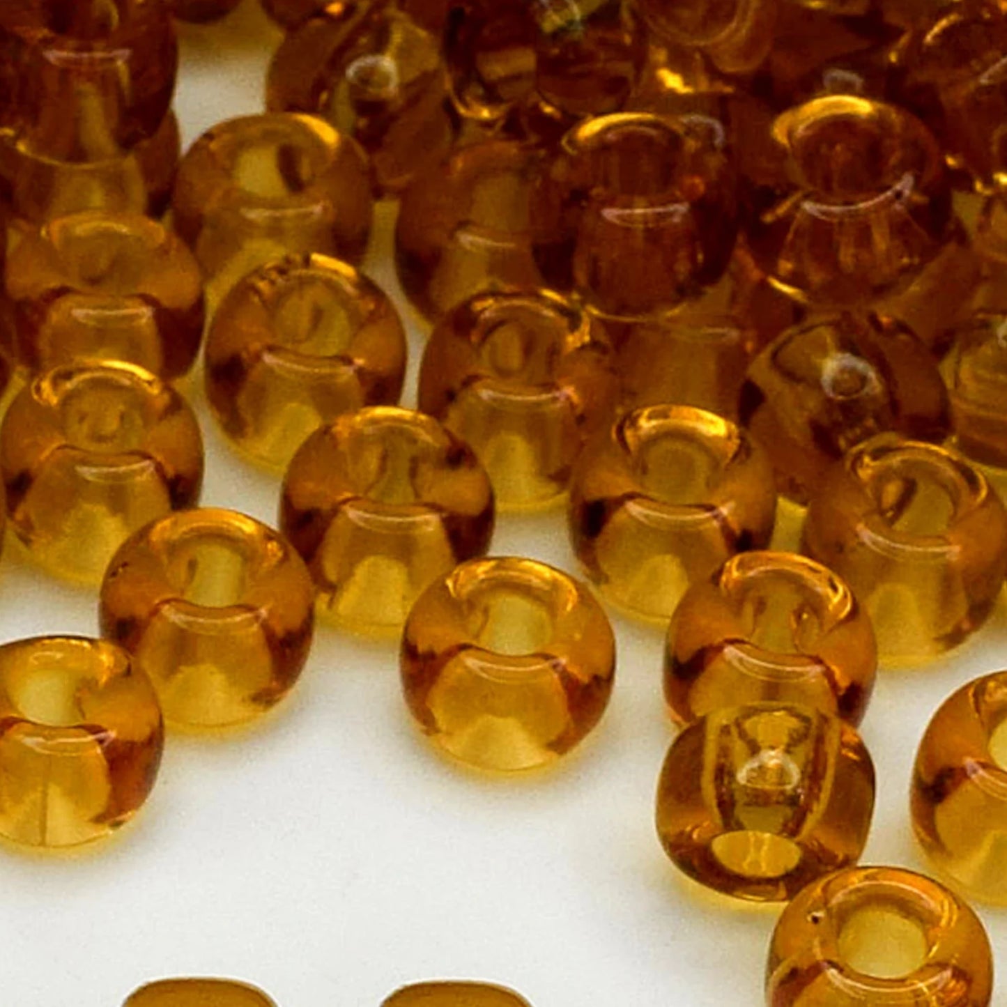 2/0 10070 Preciosa Czech Glass Seed Beads Rocailles 6.1mm. Yellow Brown Transparent natural.