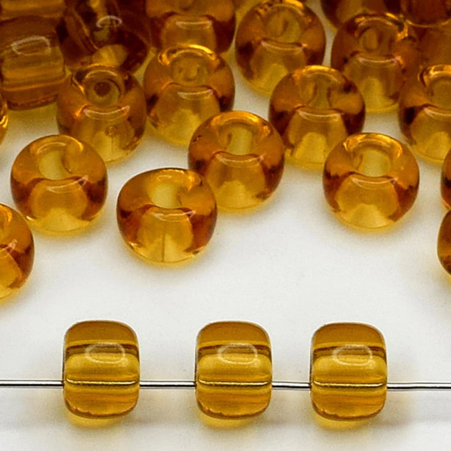 2/0 10070 Preciosa Czech Glass Seed Beads Rocailles 6.1mm. Yellow Brown Transparent natural.