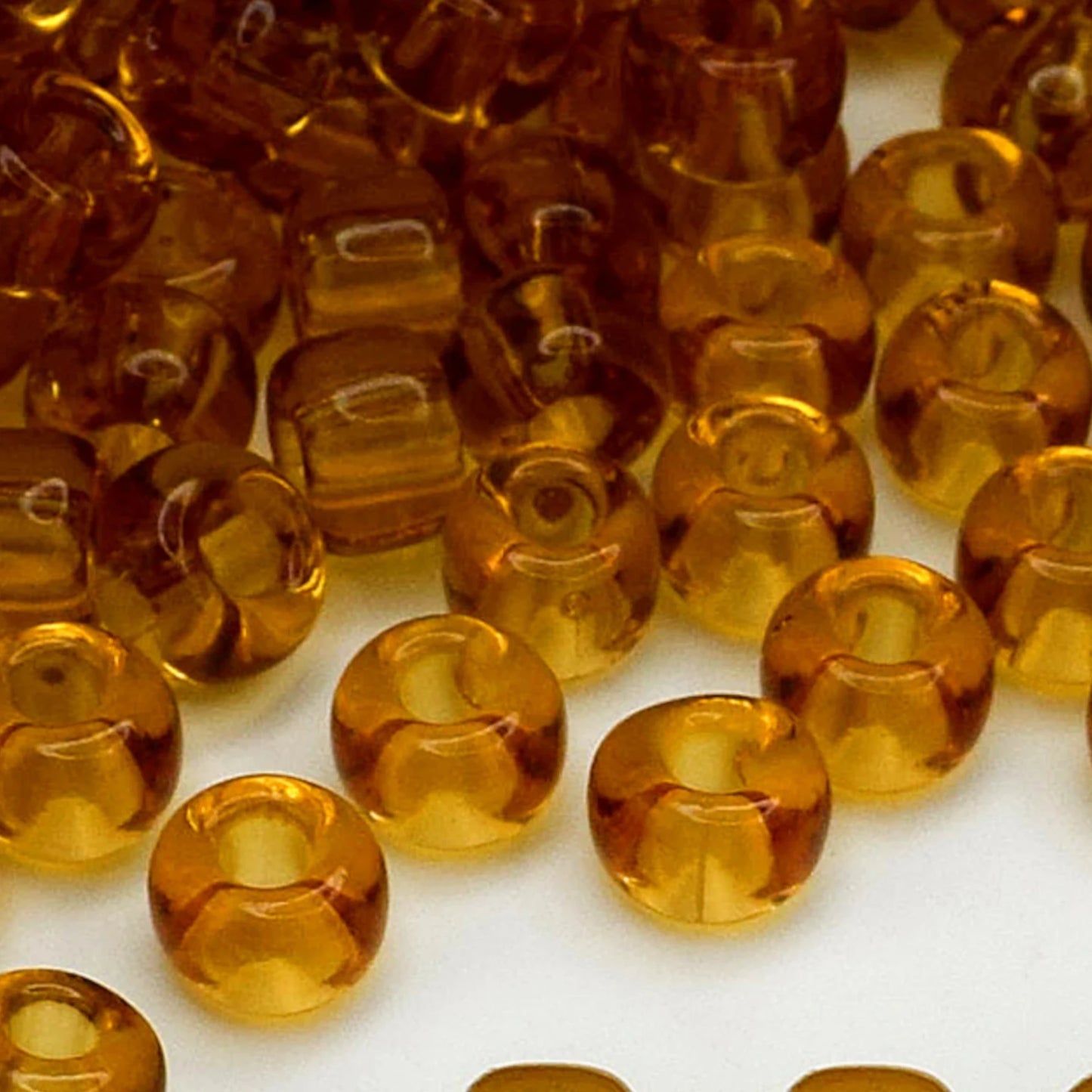 2/0 10070 Preciosa Czech Glass Seed Beads Rocailles 6.1mm. Yellow Brown Transparent natural.