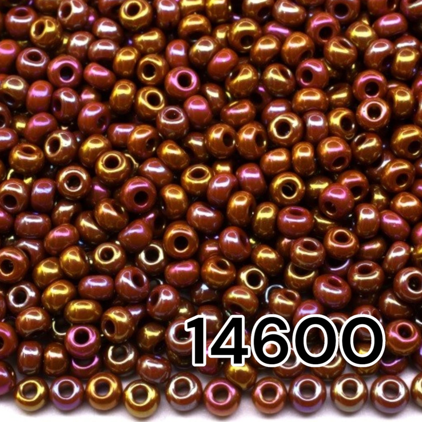 10/0 14600 Preciosa Seed Beads. Opaque rainbow brown.