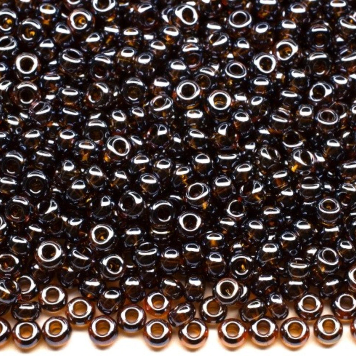 10/0 16110 Preciosa tjekkiske glasperler Rocailles 2.3mm. Gennemsigtig mørk topas Sfinx.