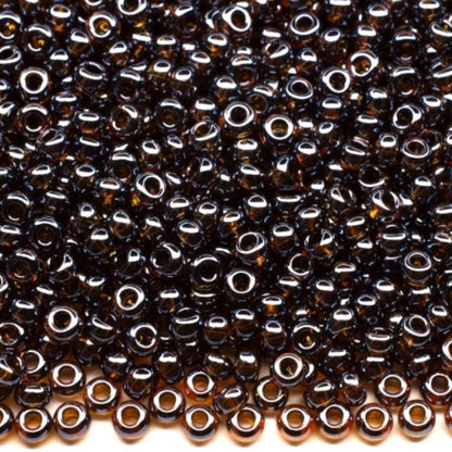 10/0 16110 Preciosa tjekkiske glasperler Rocailles 2.3mm. Gennemsigtig mørk topas Sfinx.