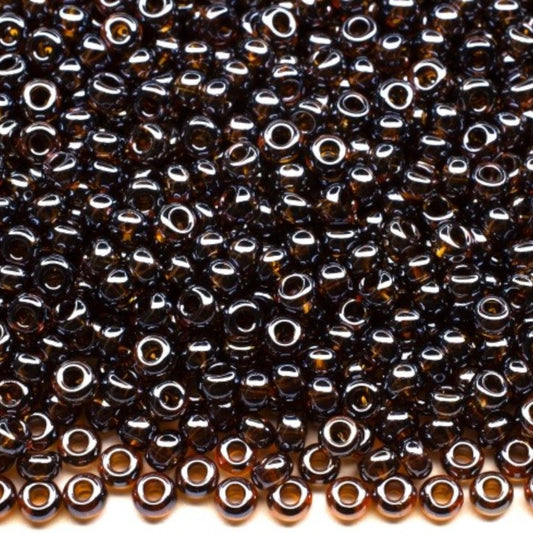 10/0 16110 Preciosa tjekkiske glasperler Rocailles 2.3mm. Gennemsigtig mørk topas Sfinx.
