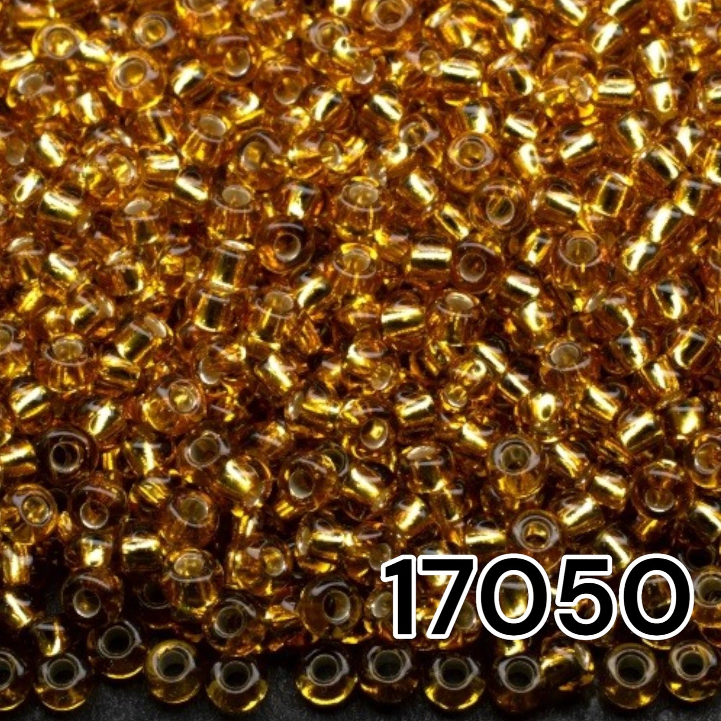 10/0 17050 Preciosa Seed Beads. Brown transparent Silver lined.