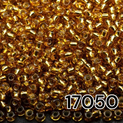 10/0 17050 Perles de graines Preciosa. Marron transparent doublé argent.