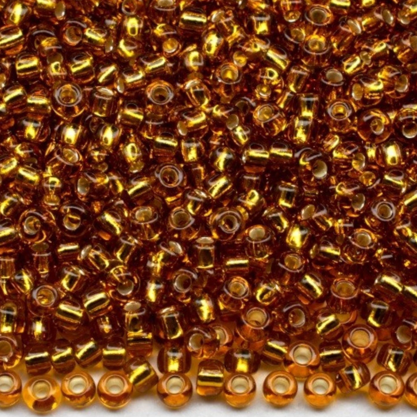 10/0 17070 Preciosa Czech Glass Koraliki Rocailles 2.3mm. Brązowe przezroczyste z srebrną powłoką.