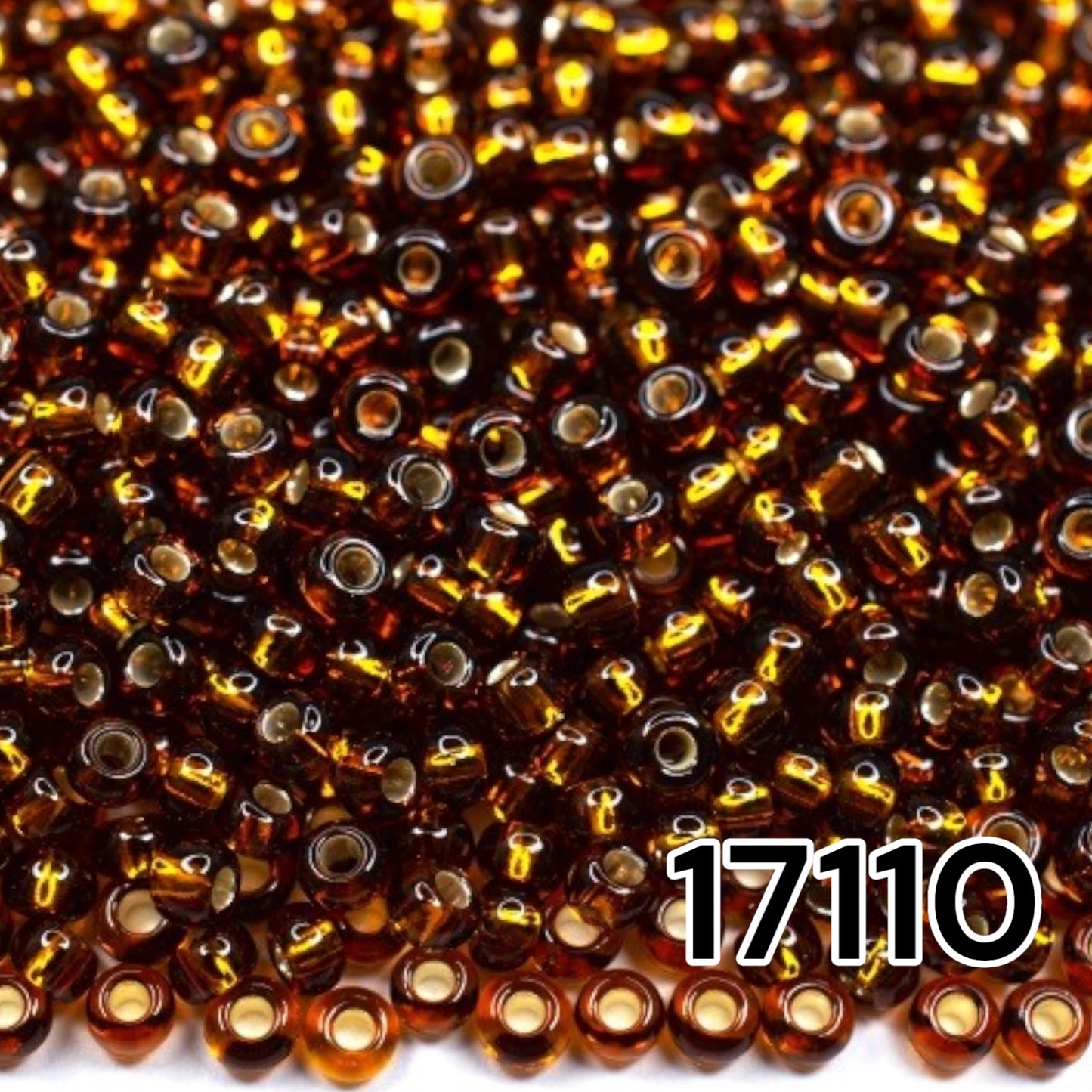 10/0 17110 Perles de graines Preciosa. Marron transparent doublé argent.