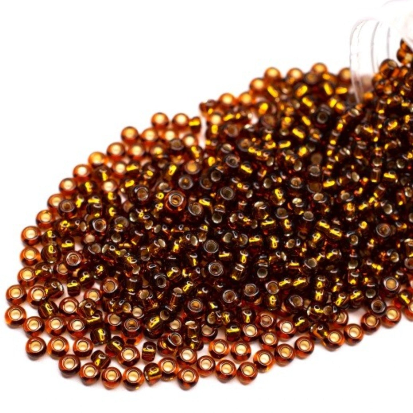 10/0 17110 Preciosa Seed Beads. Brown transparent Silver lined.