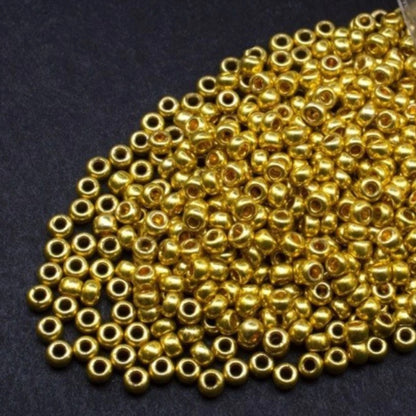 10/0 18586 Perline di vetro ceco Preciosa Rocaille 2,3 mm. Oro metallico - Terra tinto.