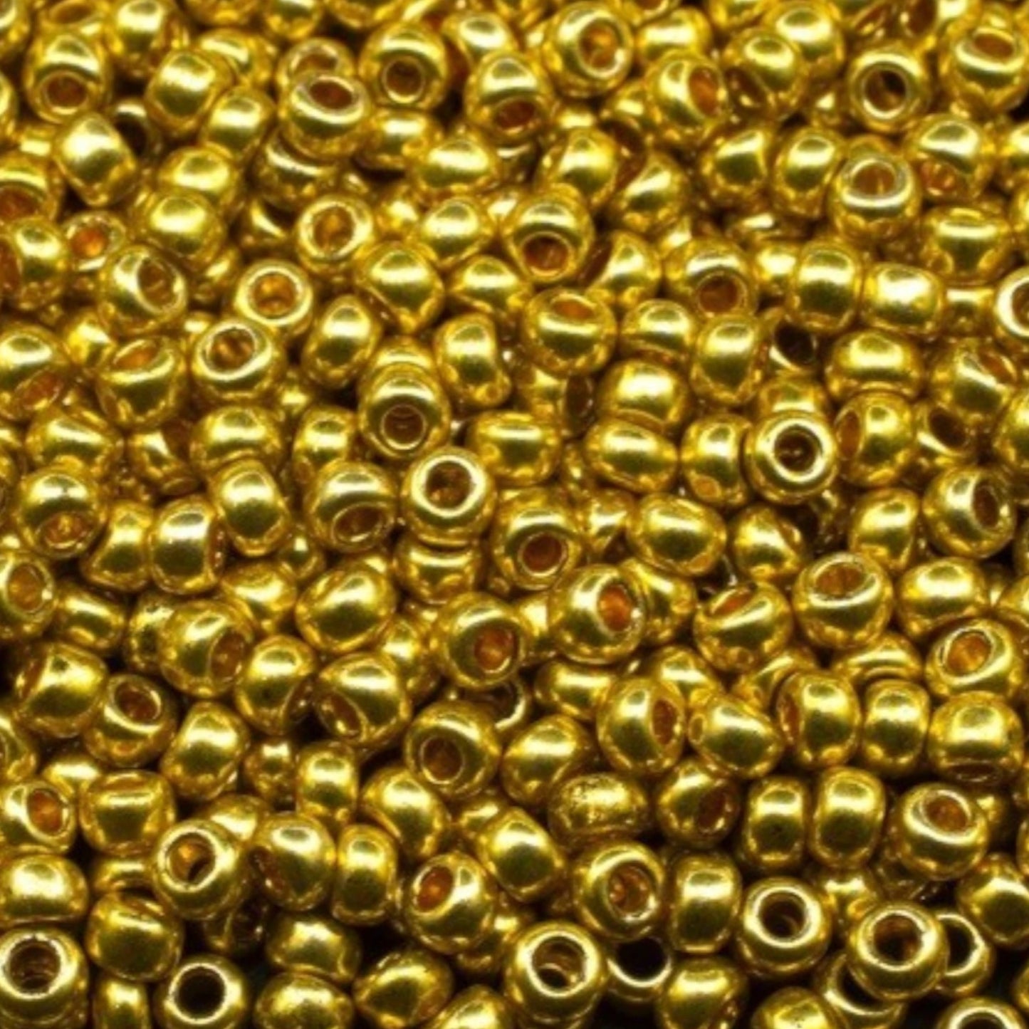 10/0 18586 Perline di vetro ceco Preciosa Rocaille 2,3 mm. Oro metallico - Terra tinto.