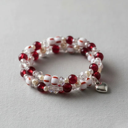 2/0 03890 Preciosa Cseh Üveg Magtartalmú Gyöngyök (Kásagyöngy) Rocailles 6.1mm. Piros Csíkok Krétafehér Alapon.