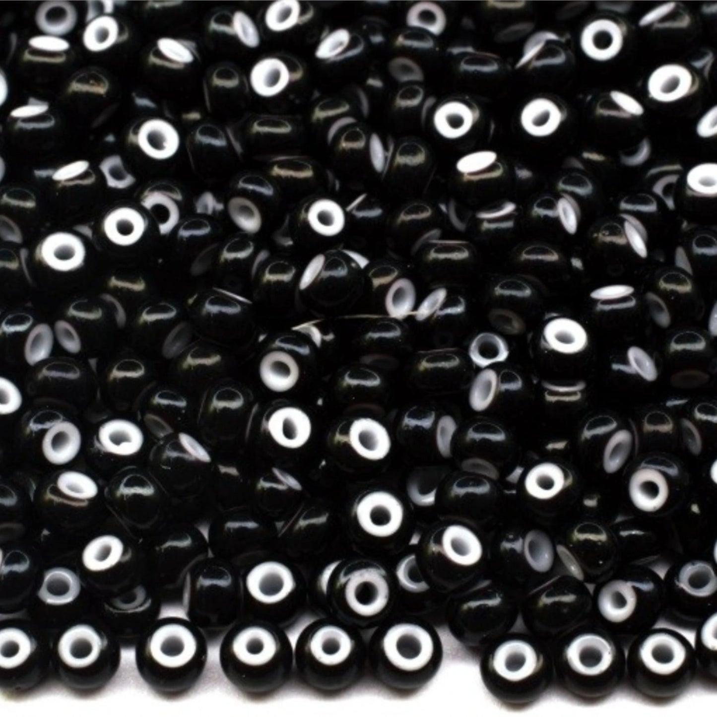 10/0 23798 Preciosa Seed Beads Rocailles. Black, White Lined.