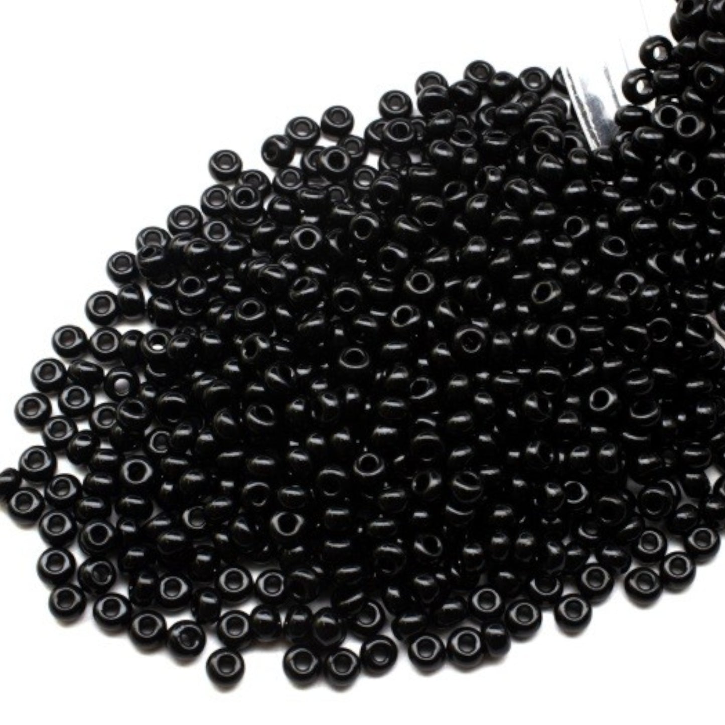 10/0 23980 Preciosa Seed Beads. Opaque black.