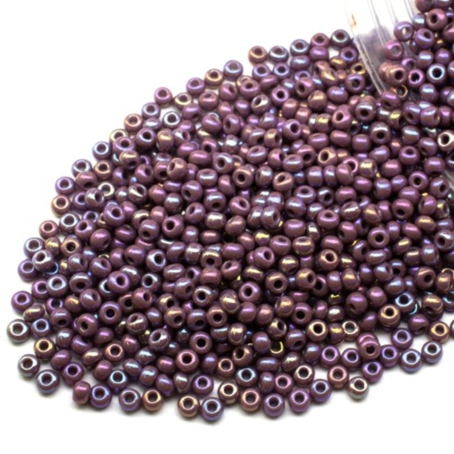 10/0 24020 Preciosa Seed Beads. Opaque rainbow purple.