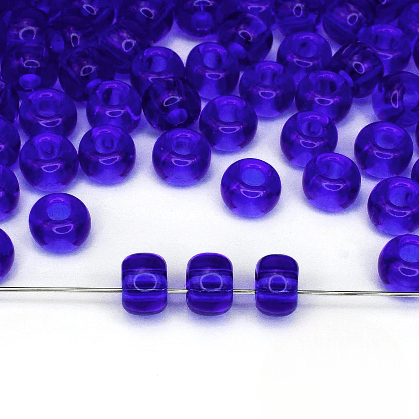 2/0 30080 Preciosa Seed Beads Blue. Transparent natural.