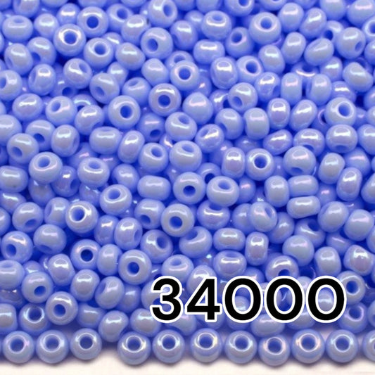 10/0 34000 Preciosa Seed Beads. Opaque rainbow light blue.