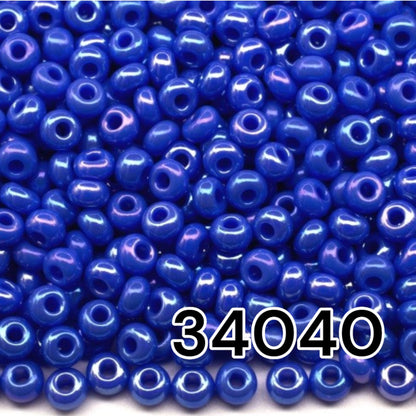 10/0 34040 Preciosa Seed Beads. Opaque rainbow blue.