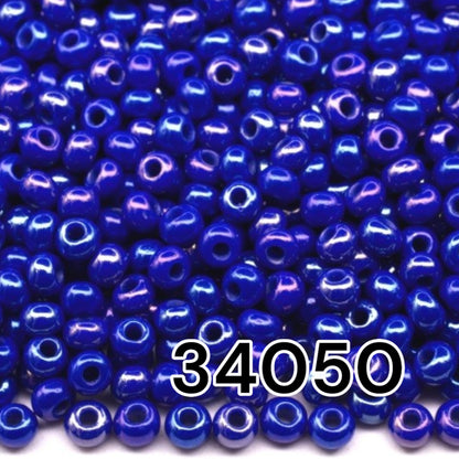 10/0 34050 Preciosa Seed Beads. Opaque rainbow blue.