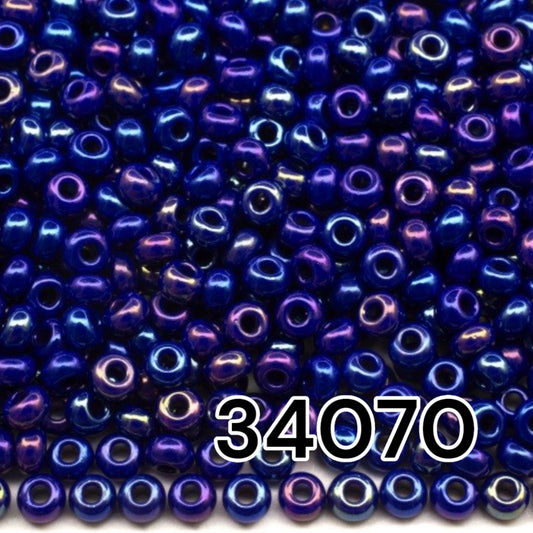 10/0 34070 Preciosa Seed Beads. Opaque rainbow blue.