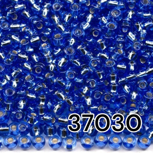 10/0 37030 Perles de graines Preciosa. Bleu transparent doublé argent.