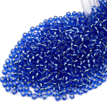 10/0 37030 Perles de graines Preciosa. Bleu transparent doublé argent.