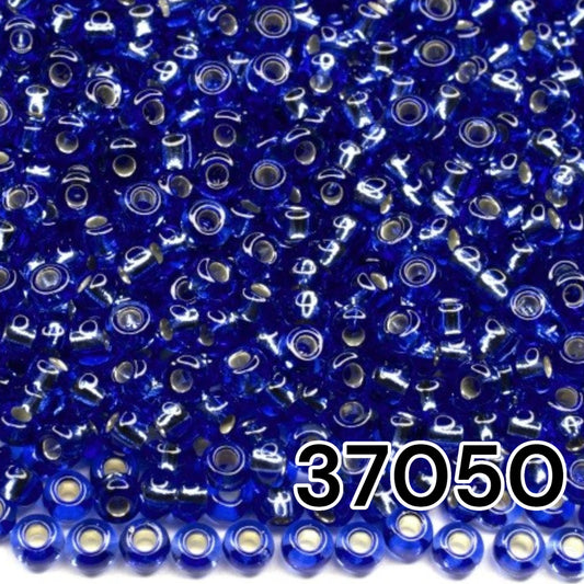 10/0 37050 Preciosa Seed Beads. Blue transparent Silver lined.