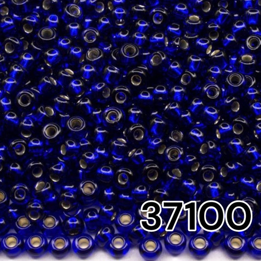 10/0 37100 Perles de graines Preciosa. Bleu transparent doublé argent.