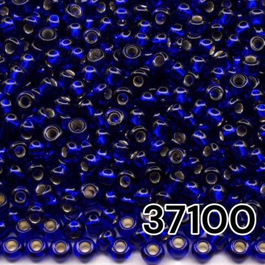 10/0 37100 Preciosa Seed Beads. Blue transparent Silver lined.