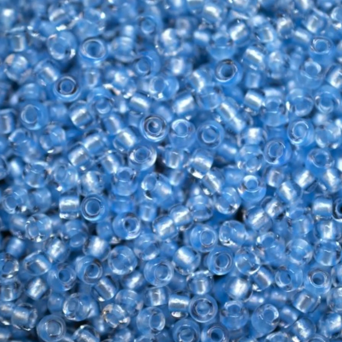 10/0 38236 Preciosa Seed Beads Light Blue. Crystal - Terra Pearl Lined.