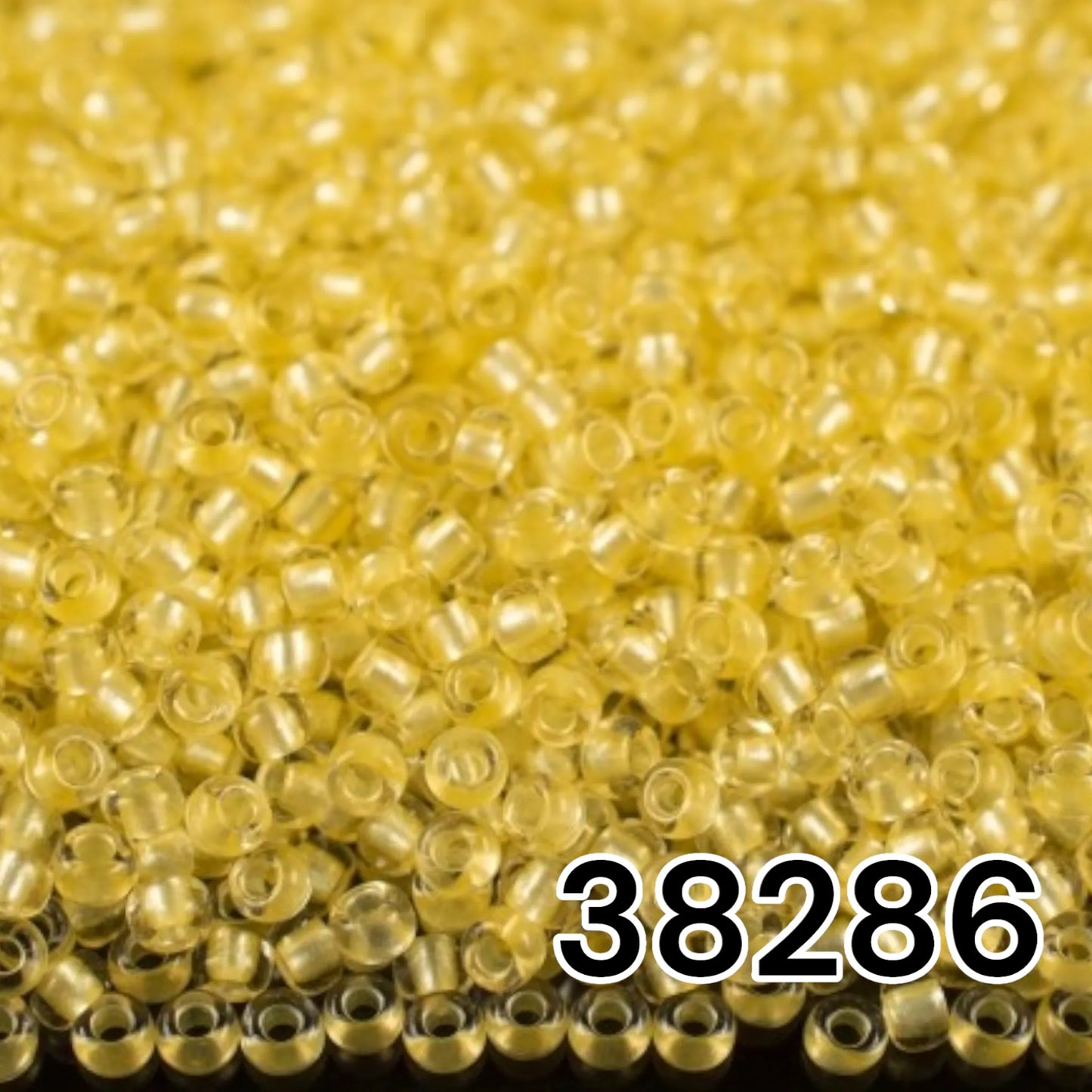 10/0 38286 Preciosa Seed Beads Yellow. Crystal - Terra Pearl Lined.