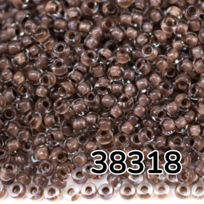 10/0 38318 Preciosa Čekiško stiklo karoliukai rokajaus 2,3 mm. Krištolo spalvos su ruda linija.