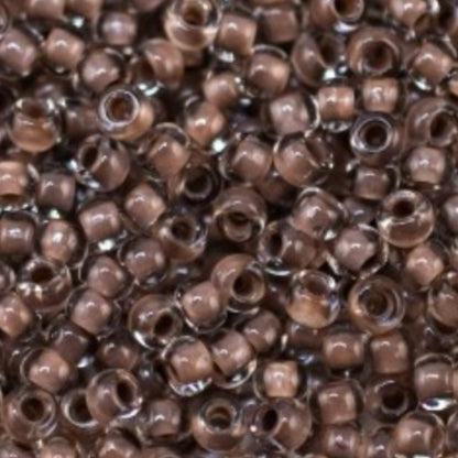 10/0 38318 Preciosa Čekiško stiklo karoliukai rokajaus 2,3 mm. Krištolo spalvos su ruda linija.