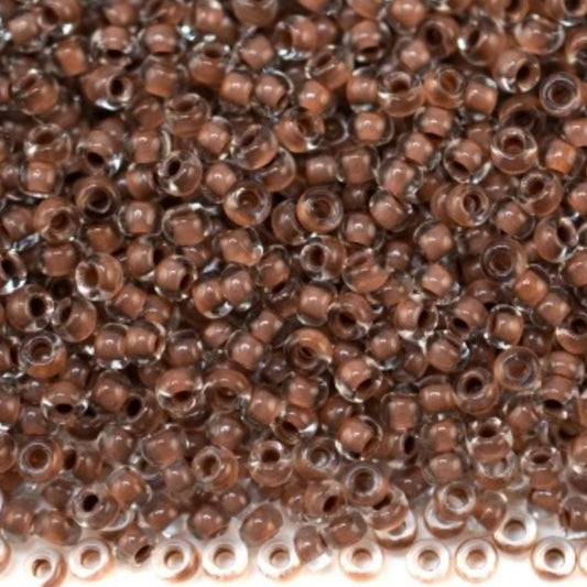 10/0 38319 Preciosa Чехлено Стъкло Малки Мъниста Рокайли 2.3 мм. Кристално Кафяво с Линия.