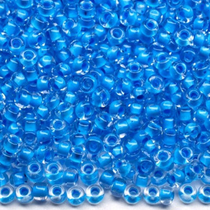 10/0 38365 Preciosa Чеський Скляний Бісер Рокайль 2,3 мм. Кришталевий колір з синьою підкладкою.