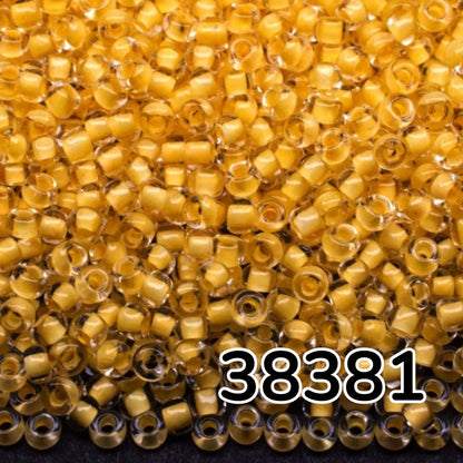 10/0 38381 Preciosa Чеський Скляний Бісер Рокайль 2.3 мм. Кришталевий Колір з Жовтим Покриттям.