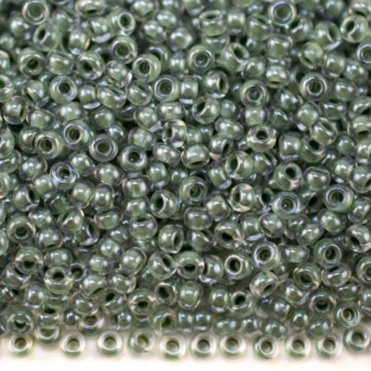 10/0 38659 Preciosa czeskie szklane koraliki Rocailles 2,3 mm. Kryształowy kolor z zielonym wykończeniem Sfinx.