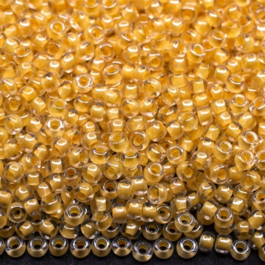 10/0 38681 Preciosa czeskie szklane koraliki Rocailles 2,3 mm. Kryształowy kolor z żółtą powłoką Sfinx.