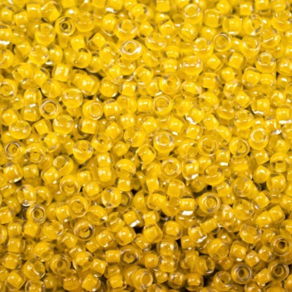 10/0 38686 Preciosa Чехлено Стъкло Малки Мъниста Рокайли 2.3 мм. Кристално Жълто с Линия Сфинкс.