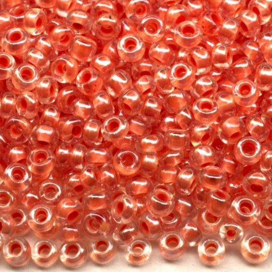 10/0 38689 Preciosa czeskie szklane koraliki Rocailles 2,3 mm. Kryształowy kolor z pomarańczową obwódką Sfinx.