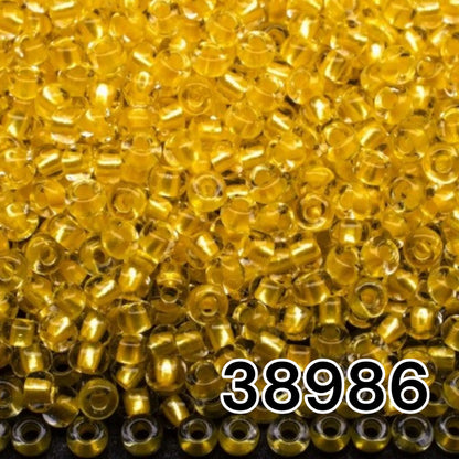38986 Rocailles tchèques PRECIOSA Rocailles 10/0 jaune. Cristal – Terra Pearl doublé.